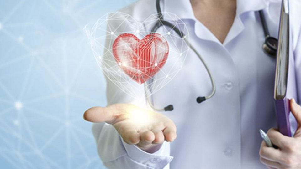 A person wearing a medical uniform and stethoscope with an outstretched hand and an image of a heart above the hand